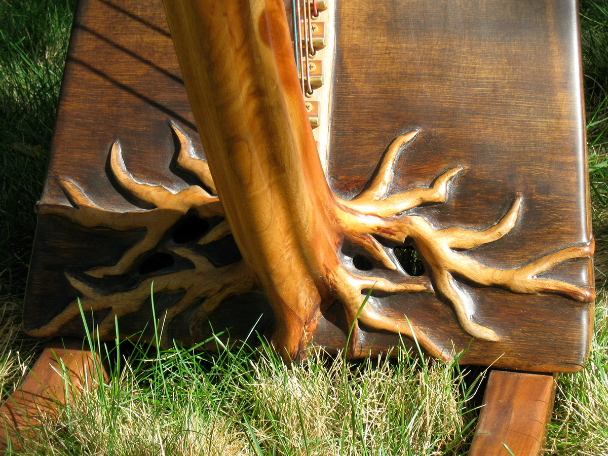 Detail of Rivendell Harp's base, hand carved with tree roots