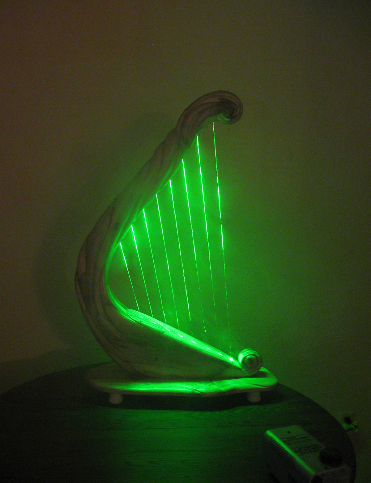 Custom built and hand carved laser harp by Glenn J Hill of Mountain Glen Harps, Phoenix, Oregon