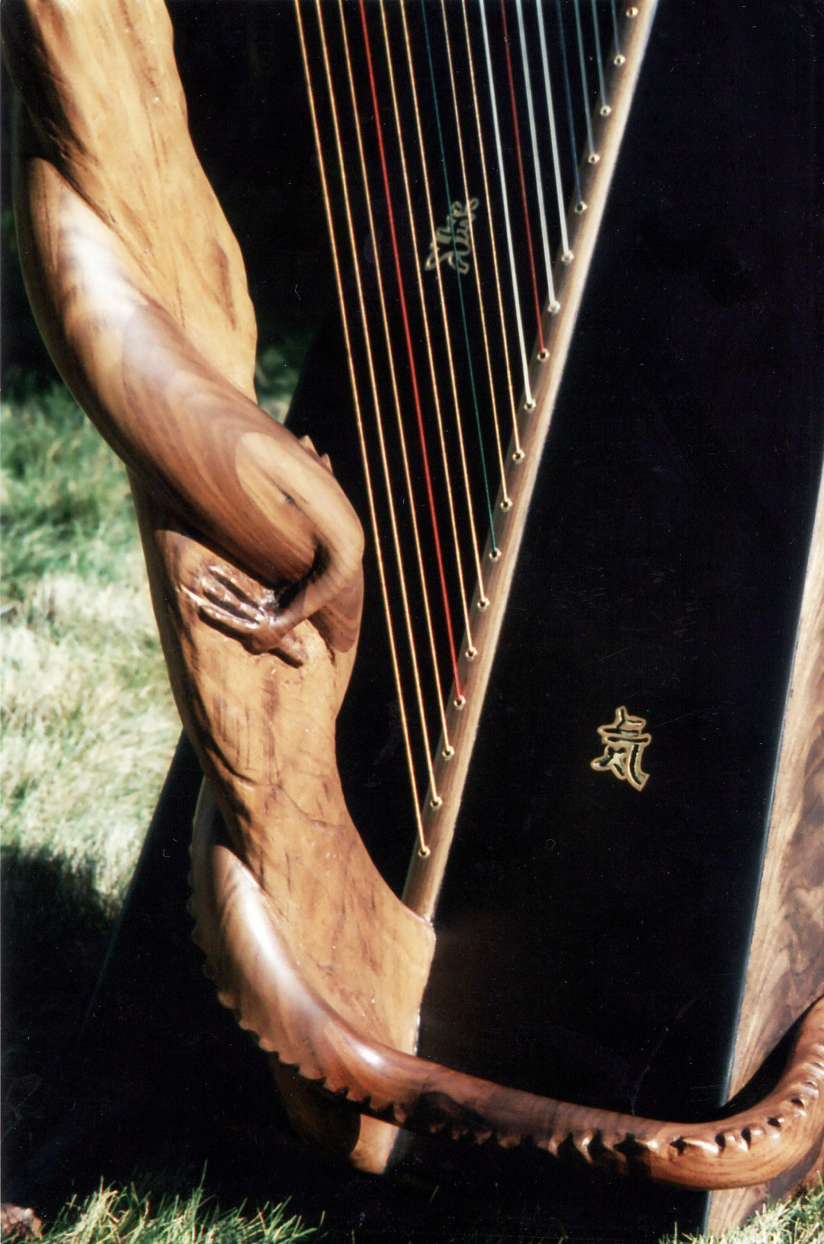 Custom built and hand carved Dragon harp by Glenn J Hill of Mountain Glen Harps, Phoenix, Oregon